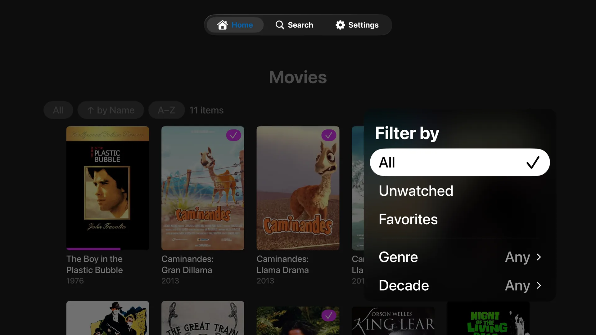 Movies library with the Filter by menu open, offering All, Unwatched, Favorites, Genre and Decade